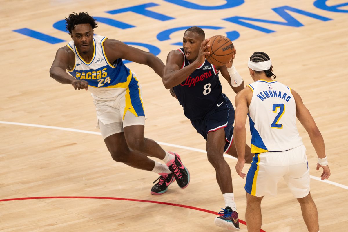LA Clippers guard Kris Dunn (2) drives through two defenders during an NBA game between the Indiana Pacers and the LA Clippers on Wednesday, March 4, 2026 at Intuit Dome in Inglewood Calif