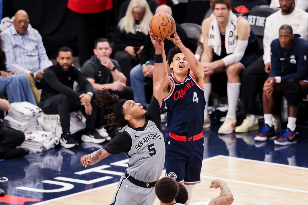 Stephon Castle #5 of the San Antonio Spurs and Kobe Sanders #4 of the LA Clippers jump for a loose ball during an NBA basketball game, Monday March 16, 2026 in Inglewood, Calif. Stephon Castle #5 of the San Antonio Spurs and Kobe Sanders #4 of the LA Clippers jump for a loose ball during an NBA basketball game, Monday March 16, 2026 in Inglewood, Calif.