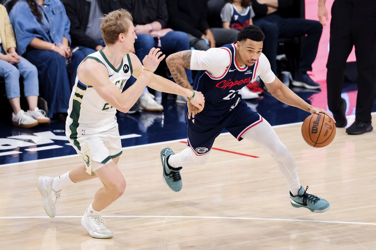 Jordan Miller #22 of the LA Clippers handles the ball during an NBA basketball game against the Milwaukee Bucks, Monday March 23, 2026 in Inglewood, Calif.