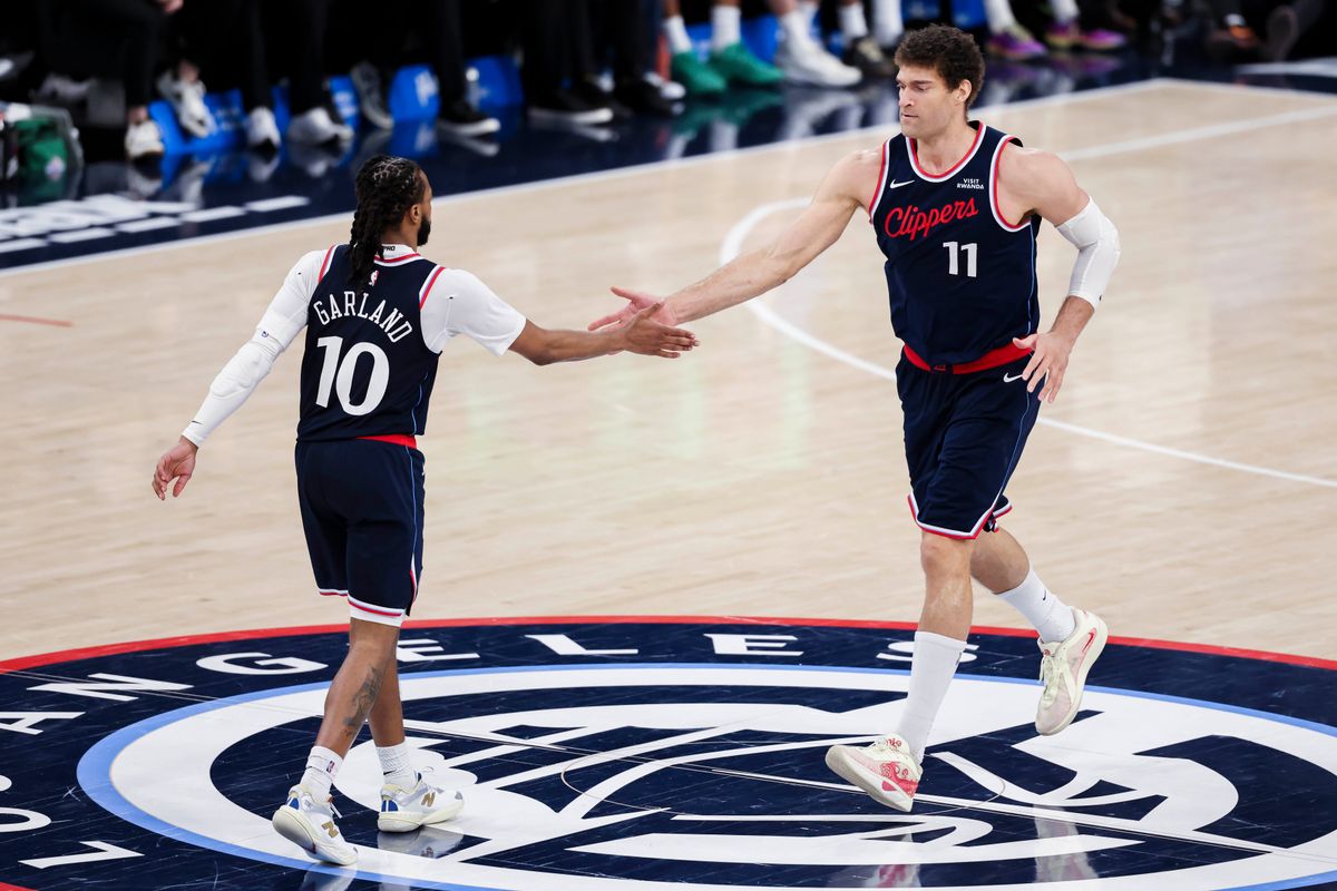 Darius Garland #10 and Brook Lopez #11 of the LA Clippers high five after a play during an NBA basketball game against the Milwaukee Bucks, Monday March 23, 2026 in Inglewood, Calif.