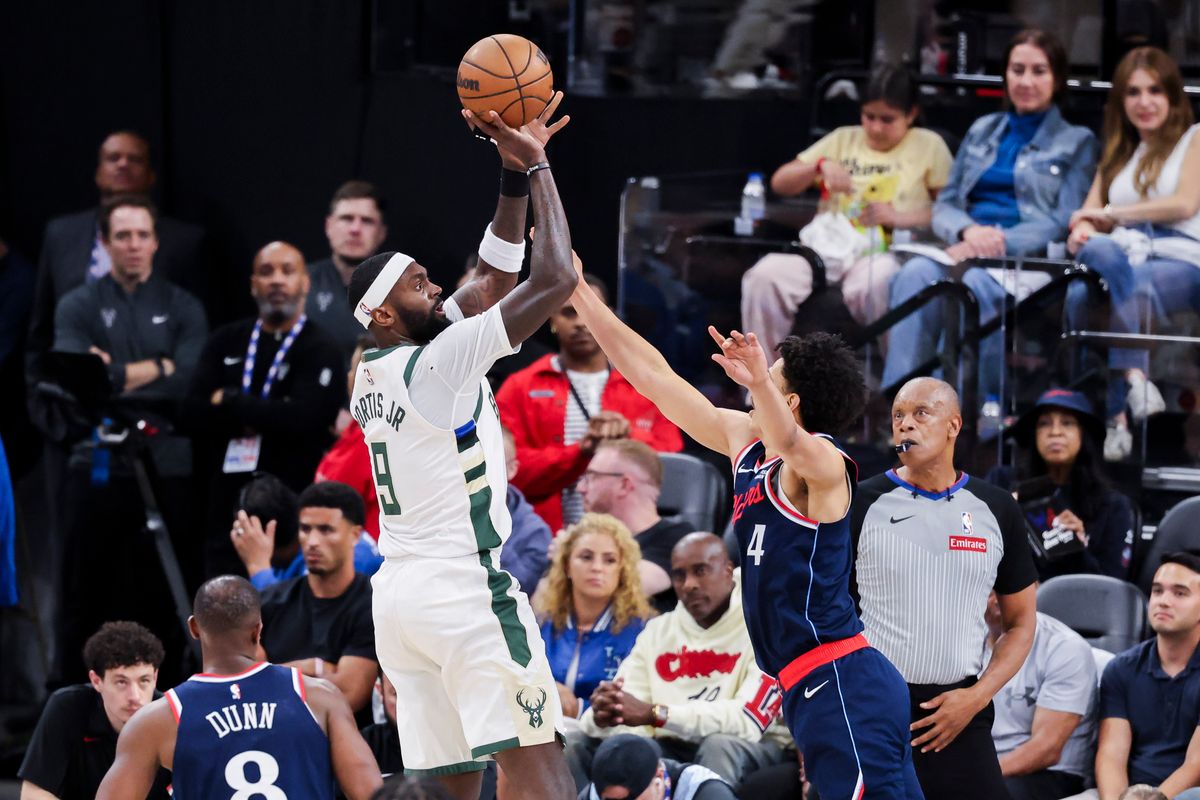 Bobby Portis #9 of the Milwaukee Bucks shoots the ball over Kobe Sanders #4 of the LA Clippers during an NBA basketball game, 2026 in Inglewood, Calif.