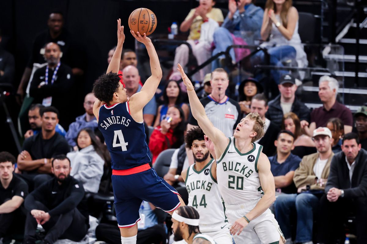 Kobe Sanders #4 of the LA Clippers shoots the ball over AJ Green #20 of the Milwaukee Bucks during an NBA basketball game, 2026 in Inglewood, Calif.