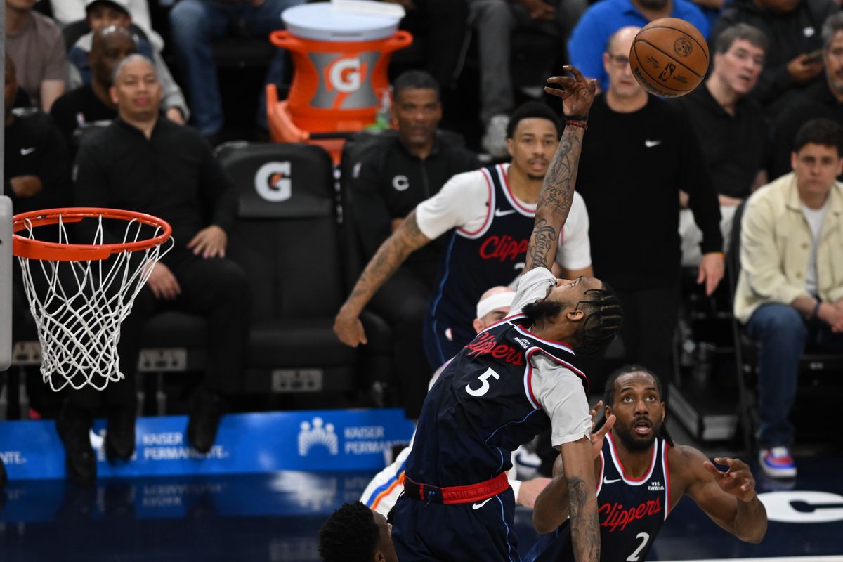 Los Angeles Clippers forward Derrick Jones Jr (5) jumps high for a rebound during a game between the Los Angeles Clippers and OKC Thunder on Wednesday, April 8, 2026 at Intuit Dome in Inglewood Calif