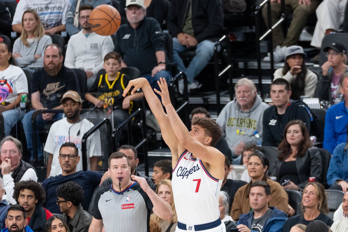 Los Angeles Clippers guard Bogdan Bogdanovic (7) shoots a three-pointer during an NBA basketball game against the Golden State Warriors,Sunday April 12th, 2026 in Inglewood, California. 