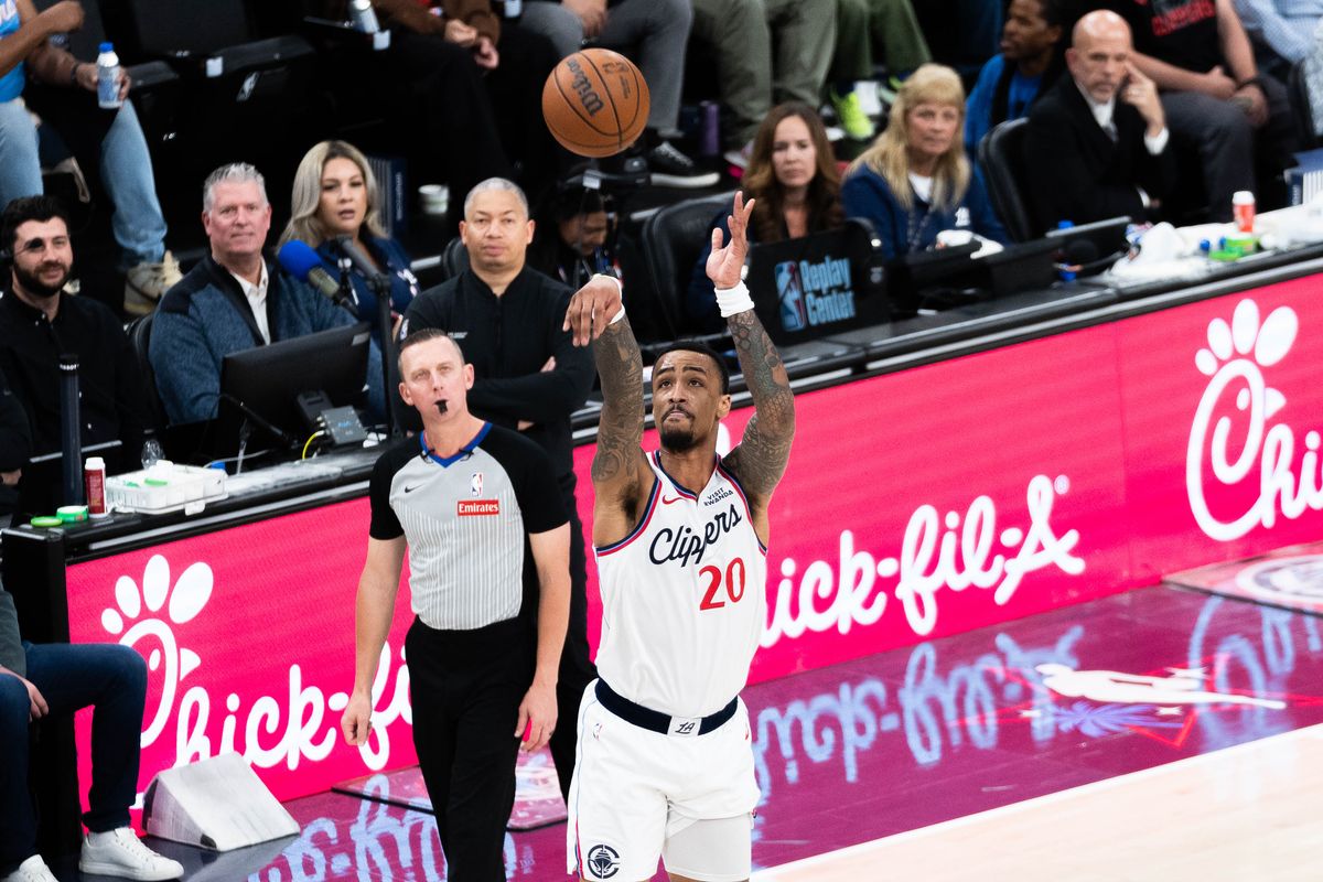 Los Angeles Clippers forward John Collins (20) shoots a three-pointer during an NBA basketball game against the Golden State Warriors,Sunday April 12th, 2026 in Inglewood, California. 
