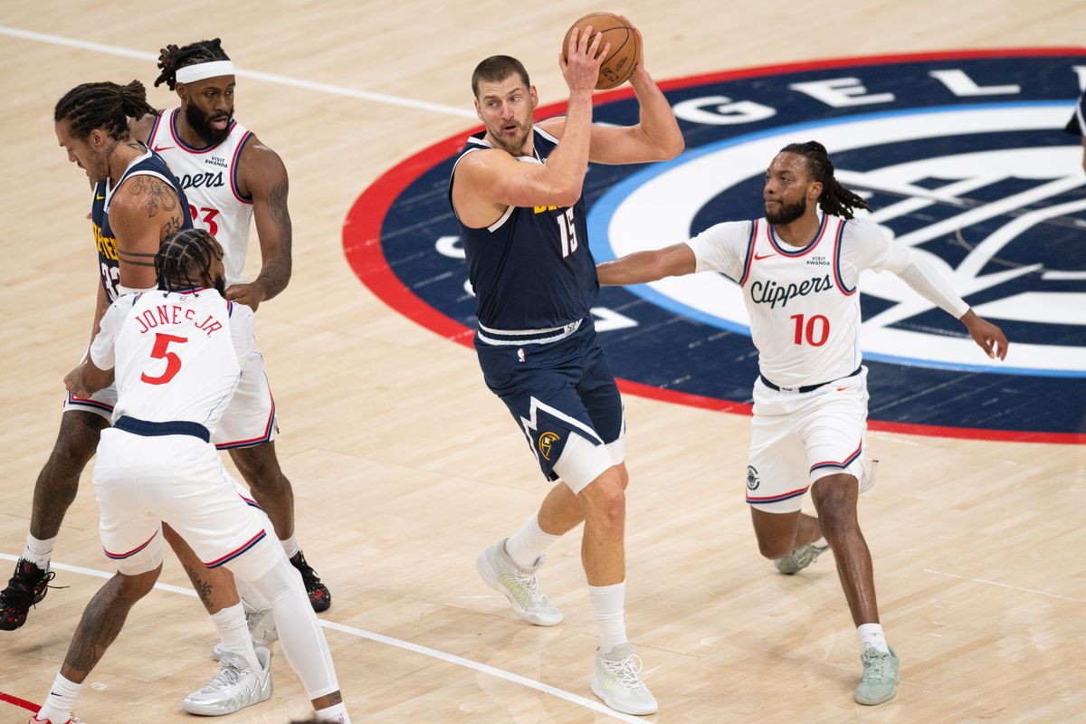 Denver Nuggets center Nikola Jokic (15) looks for the open man during an NBA basketball game against the LA Clippers, Wednesday, October 14, 2026 in Inglewood. Denver Nuggets center Nikola Jokic (15) looks for the open man during an NBA basketball game against the LA Clippers, Wednesday, October 14, 2026 in Inglewood.