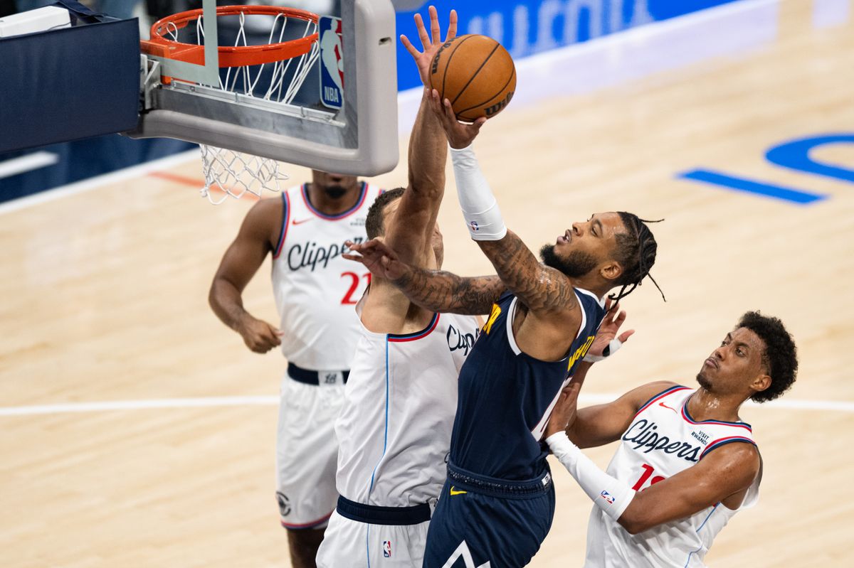 Denver Nuggets forward Cam Whitmore (00) drives for a layup during an NBA basketball game against the LA Clippers, Wednesday, October 14, 2026 in Inglewood. Denver Nuggets forward Cam Whitmore (00) drives for a layup during an NBA basketball game against the LA Clippers, Wednesday, October 14, 2026 in Inglewood.