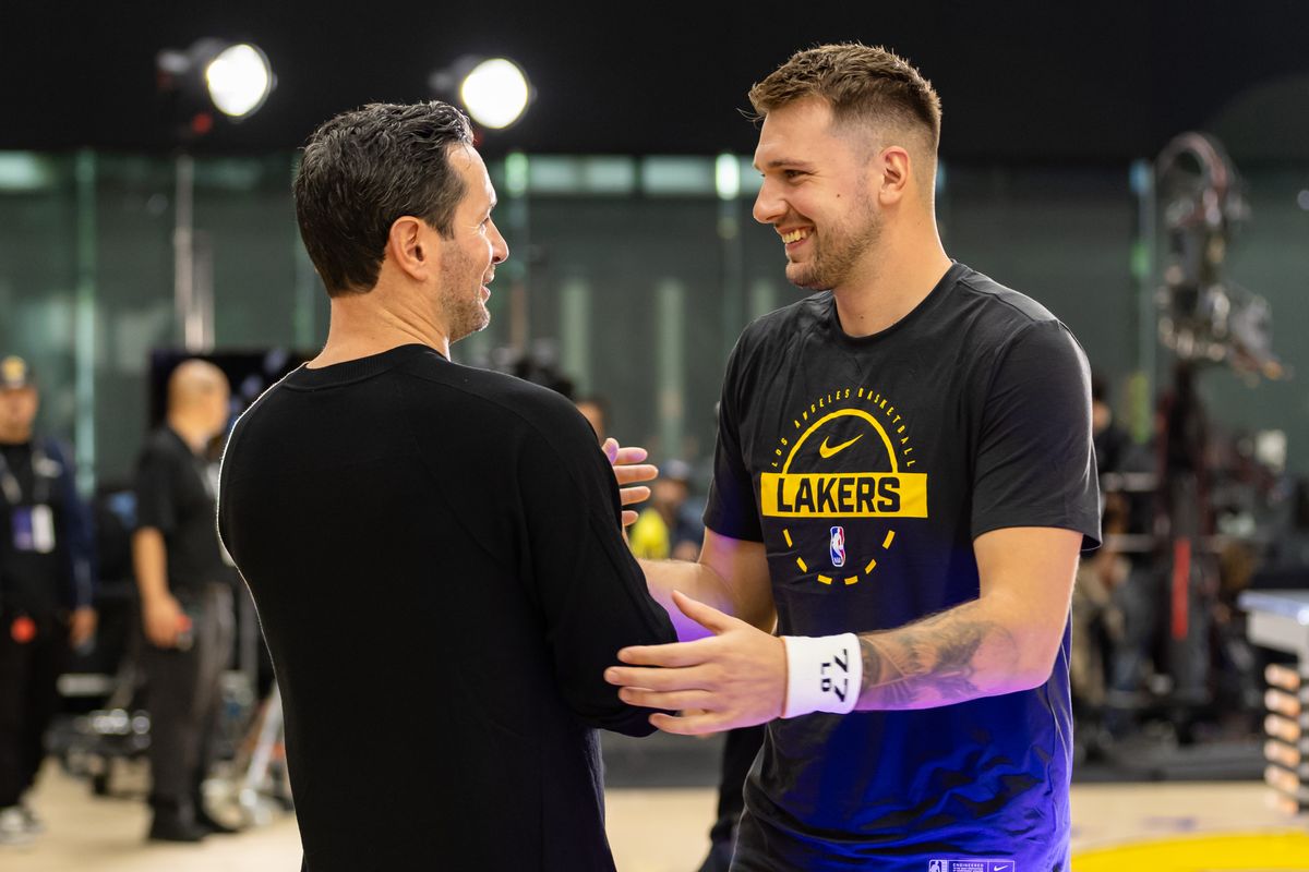 Head Coach JJ Reddick and Luka Doncic #77 of the Los Angeles Lakers greet each other during Lakers Media Day at UCLA Health Training Center on September 29, 2025 in El Segundo, California. Head Coach JJ Reddick and Luka Doncic #77 of the Los Angeles Lakers greet each other during Lakers Media Day at UCLA Health Training Center on September 29, 2025 in El Segundo, California.
