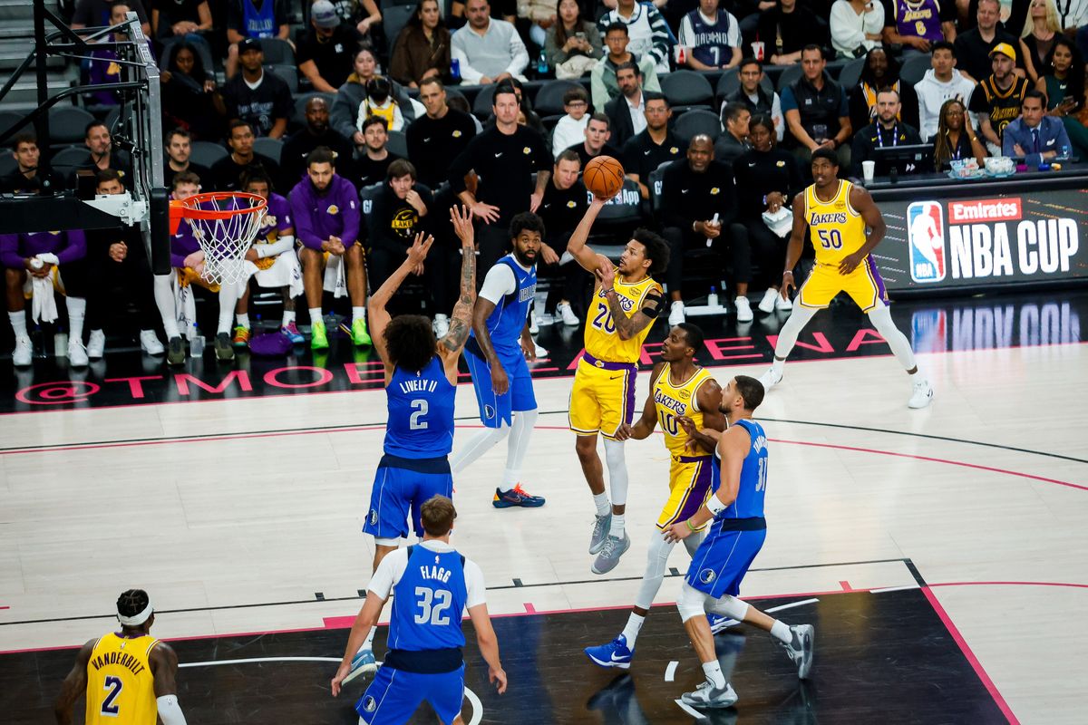 Los Angeles guard Nick Smith Jr. (20) looks to shoot a floater during a NBA preseason game between the Los Angeles Lakers and the Dallas Mavericks, Wednesday October 15, 2025 in Las Vegas, Nev. Los Angeles guard Nick Smith Jr. (20) looks to shoot a floater during a NBA preseason game between the Los Angeles Lakers and the Dallas Mavericks, Wednesday October 15, 2025 in Las Vegas, Nev.