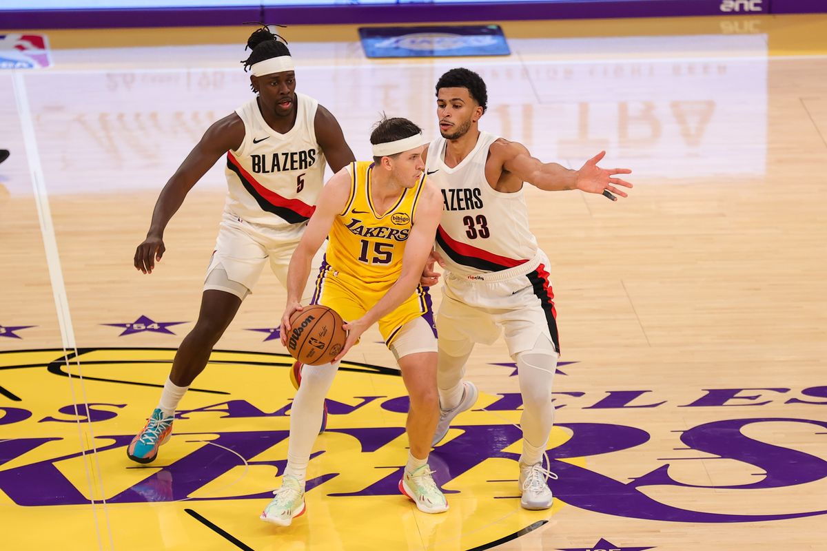 #15 G Austin Reaves of the Los Angeles Lakers dribbles the ball up court during an NBA game against the Portland Trailblazers on October 27, 2025 in Los Angeles, CA.