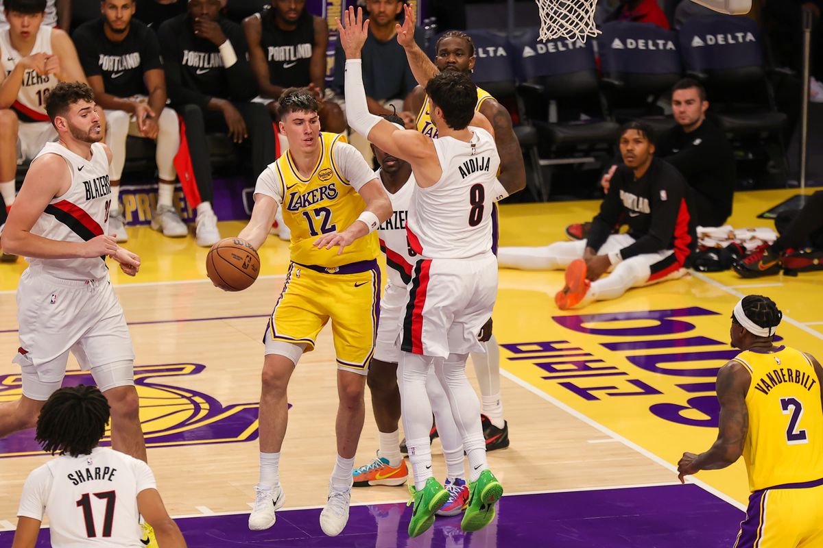 #12 F Jake LaRavia of the Los Angeles Lakers makes a pass during an NBA game against the Portland Trailblazers on October 27, 2025 in Los Angeles, CA.