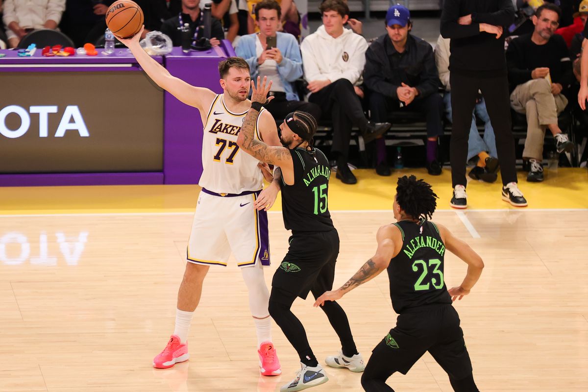 #77 PG Luka Doncic of the Los Angeles Lakers surveys the floor during an NBA game against the New Orleans Pelicans on November 30, 2025 in Los Angeles, CA.