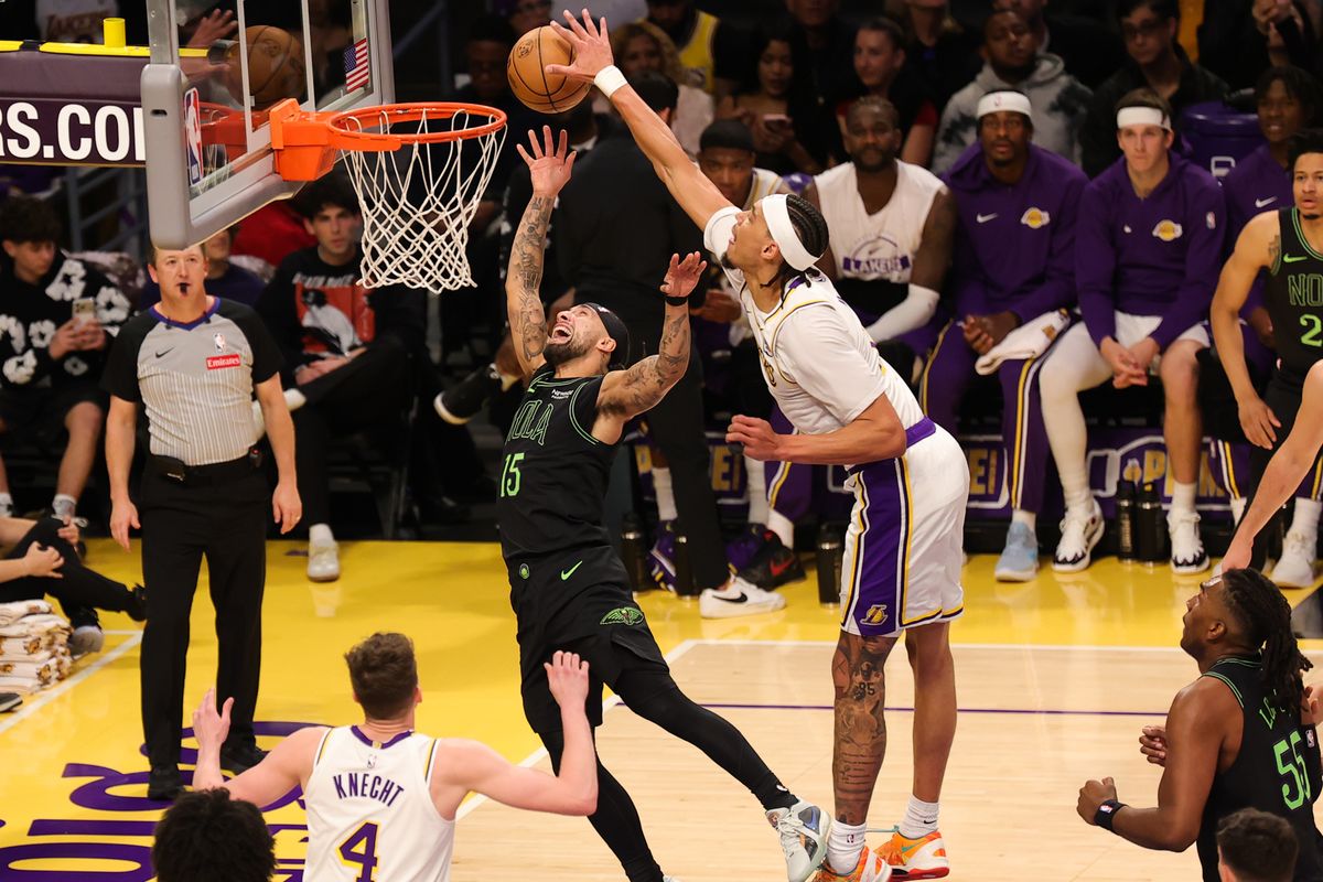 #11 C Jaxson Hayes of the Los Angeles Lakers blocks the shot of #15 G Jose Alvarado of the New Orlean Pelicans during an NBA game on November 30, 2025 in Los Angeles, CA.