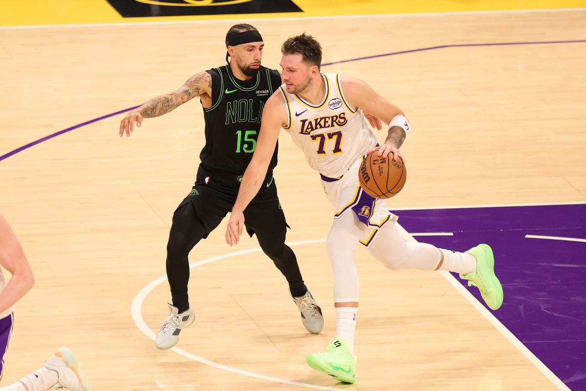 #77 PG Luka Doncic of the Los Angeles Lakers dribbles the basketball during an NBA game against the New Orleans Pelicans on November 30, 2025 in Los Angeles, CA.
