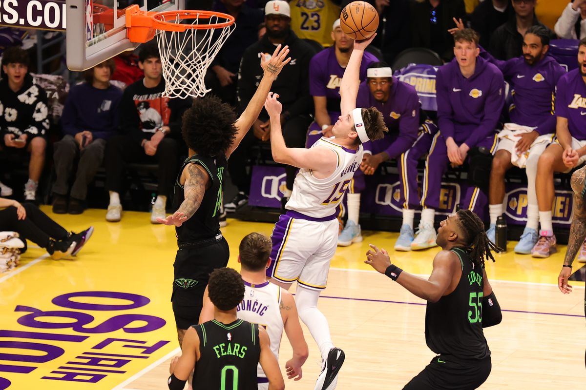 #15 G Austin Reaves of the Los Angeles Lakers attempts a lay up during an NBA game against the New Orleans Pelicans on November 30, 2025 in Los Angeles, CA.