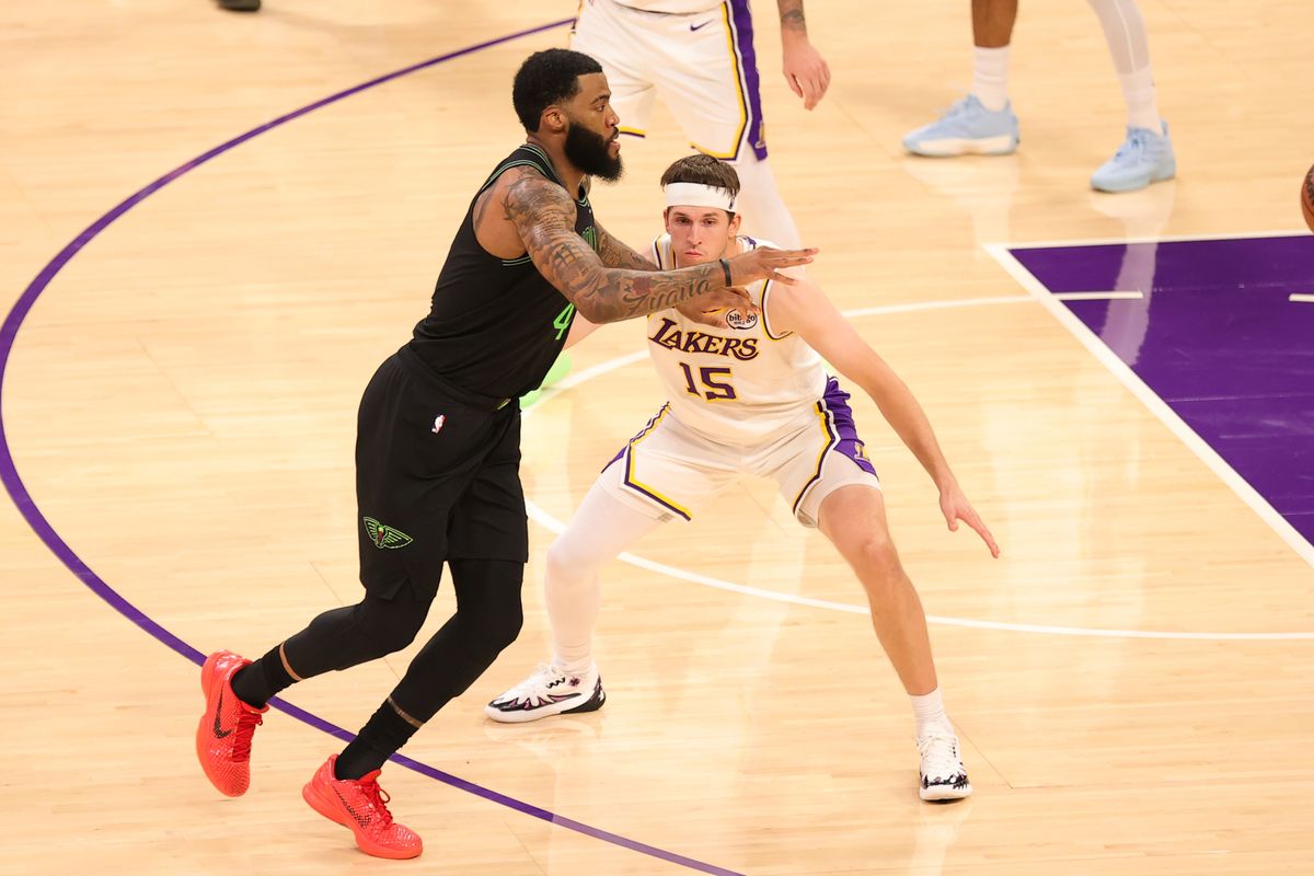 #15 G Austin Reaves of the Los Angeles Lakers guards #41 F Saddiq Bey of the New Orlean Pelicans during an NBA game on November 30, 2025 in Los Angeles, CA.