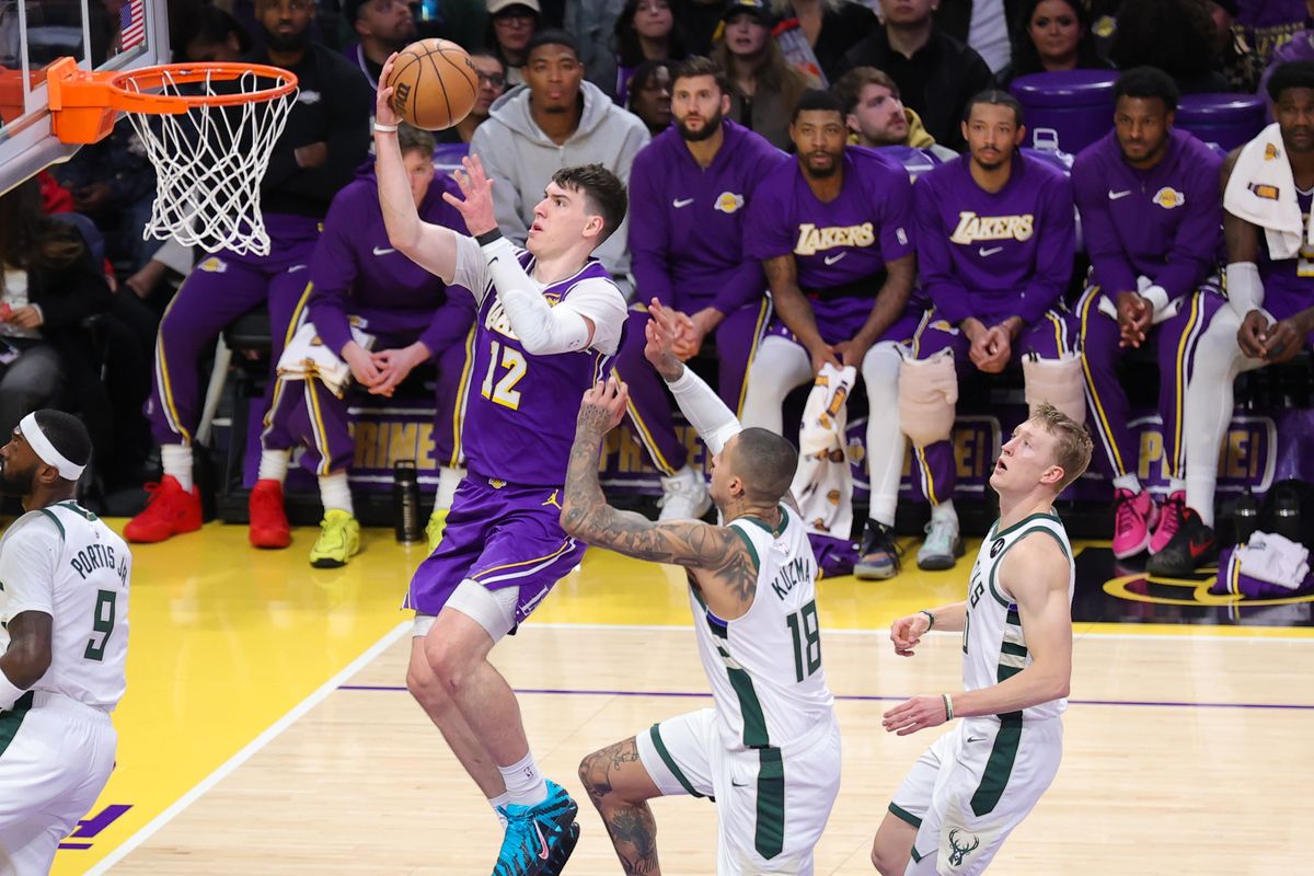 Los Angeles Lakers F Jake LaRavia (12) drives the lane during an NBA game against the Milwaukee Bucks on January 9, 2026 in Los Angeles, CA.