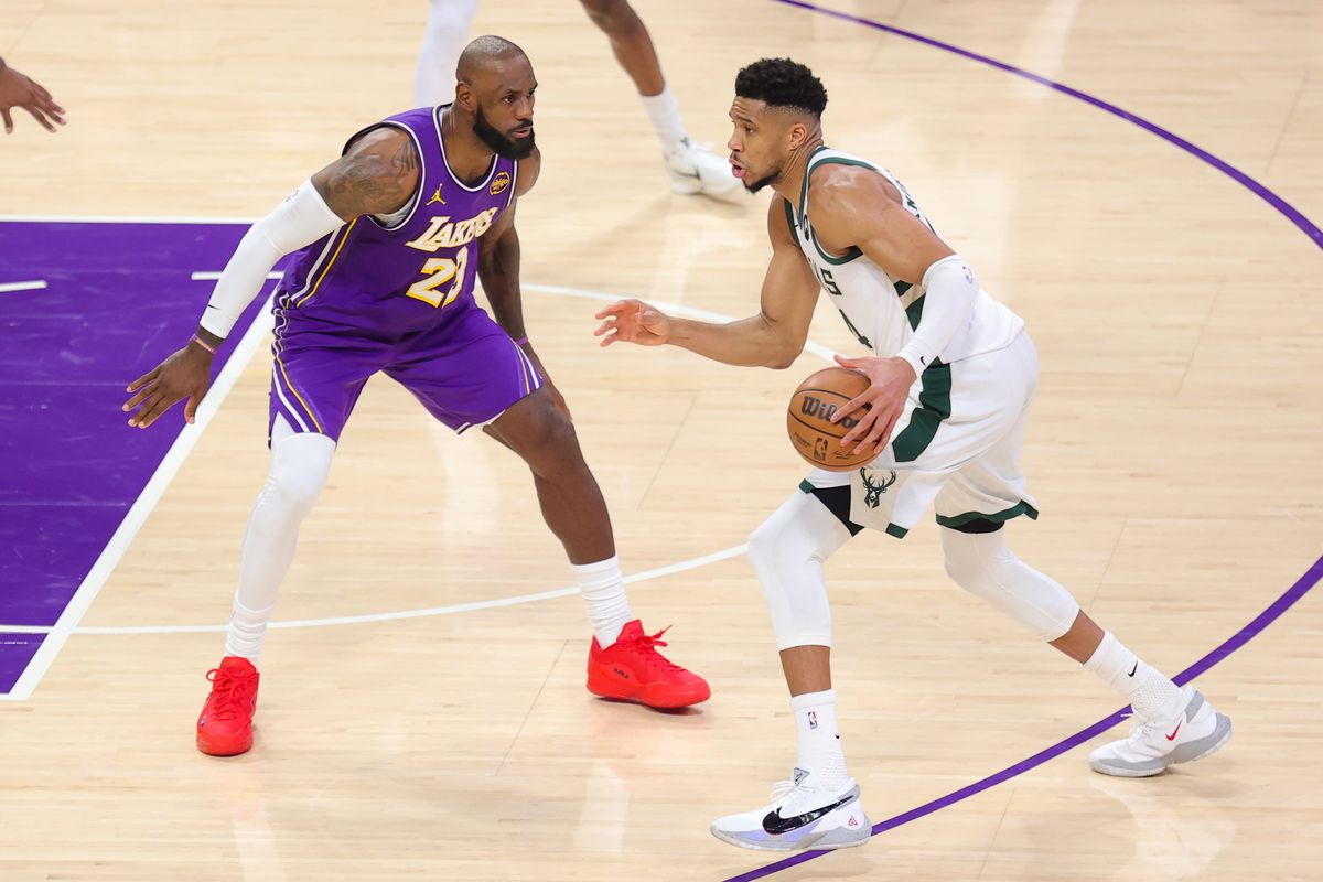 Los Angeles Lakers SF LeBron James (23) guards Milwaukee Bucks SF Giannis Antetokounmpo (34) during an NBA game on January 9, 2026 in Los Angeles, CA.