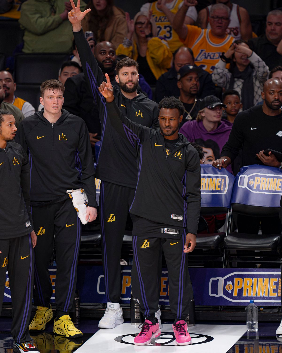 Los Angeles Lakers players celebrating a teammate's 3 point play during an NBA basketball game against the Atlanta Hawks on January 13th, 2026 in Los Angeles, CA.