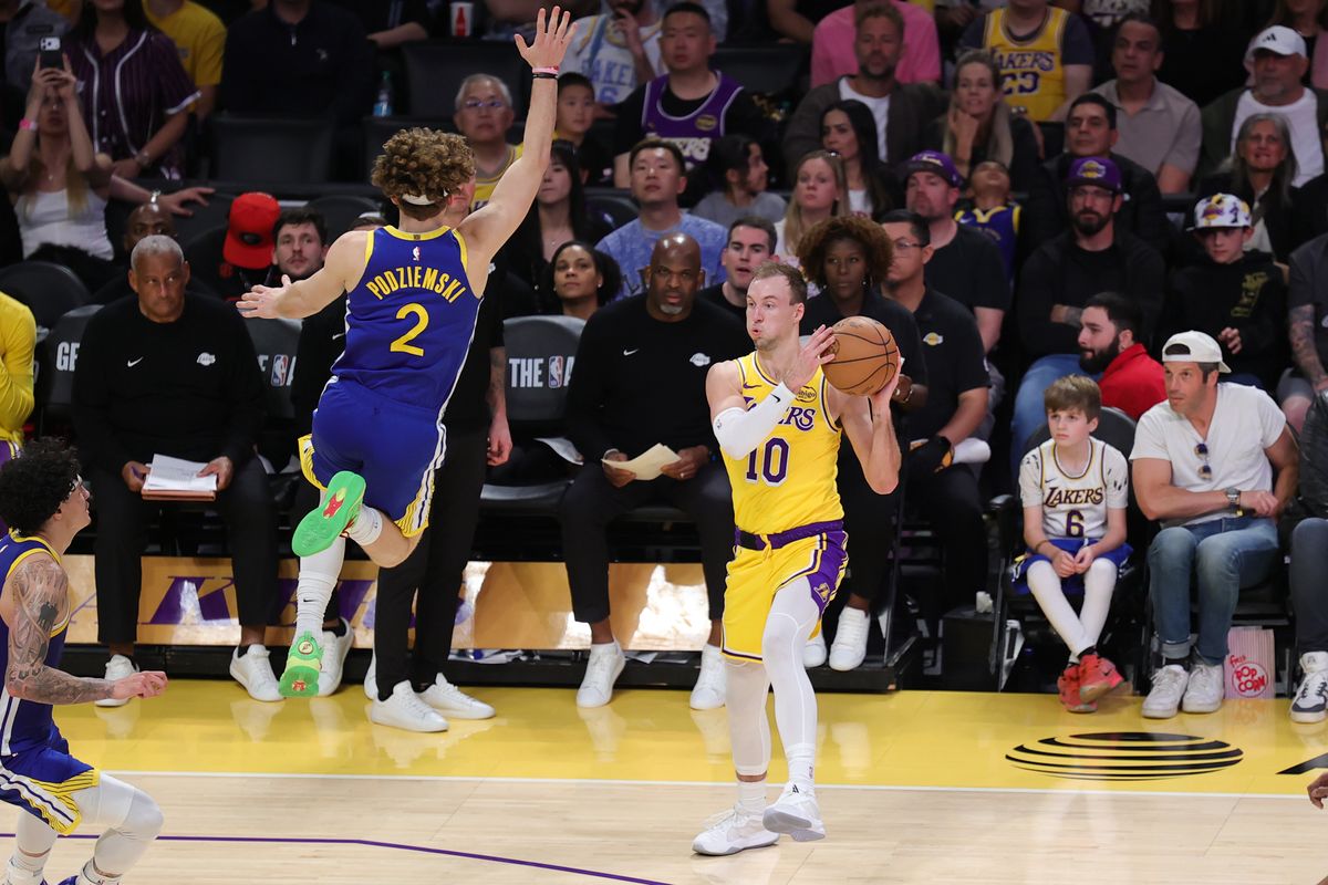 Los Angeles Lakers guard Luke Kennard (10) looks to pass the basketball during an NBA game against the Golden State Warriors on February 7, 2025 in Los Angeles, CA. Los Angeles Lakers guard Luke Kennard (10) looks to pass the basketball during an NBA game against the Golden State Warriors on February 7, 2025 in Los Angeles, CA.