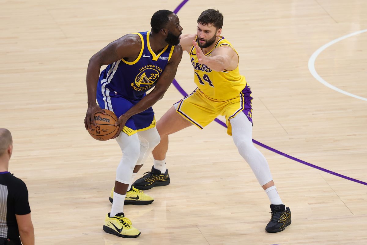 Los Angeles Lakers forward Maxi Kleber (14) defends against Golden State Warriors forward Draymond Green (23) during an NBA game on February 7, 2025 in Los Angeles, CA. Los Angeles Lakers forward Maxi Kleber (14) defends against Golden State Warriors forward Draymond Green (23) during an NBA game on February 7, 2025 in Los Angeles, CA.
