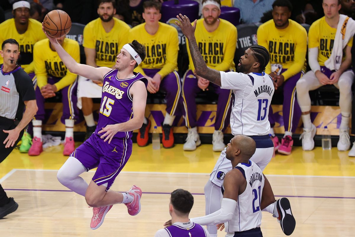 Los Angeles Lakers guard Austin Reaves (15) glides in for a lay up during an NBA game against the Dallas Mavericks on February 12, 2026 in Los Angeles, CA.