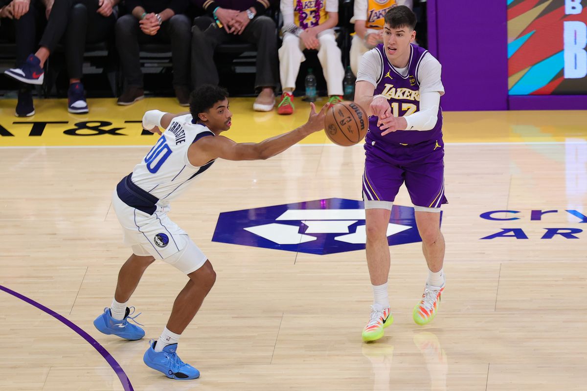 Los Angeles Lakers forward Jake LaRavia (12) passes the basketball during an NBA game against the Dallas Mavericks on February 12, 2026 in Los Angeles, CA.