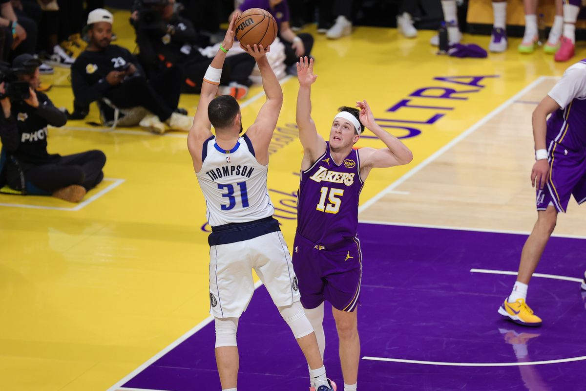 Los Angeles Lakers guard Austin Reaves (15) defends against Dallas Mavericks guard Klay Thompson (31) during an NBA game on February 12, 2026 in Los Angeles, CA.