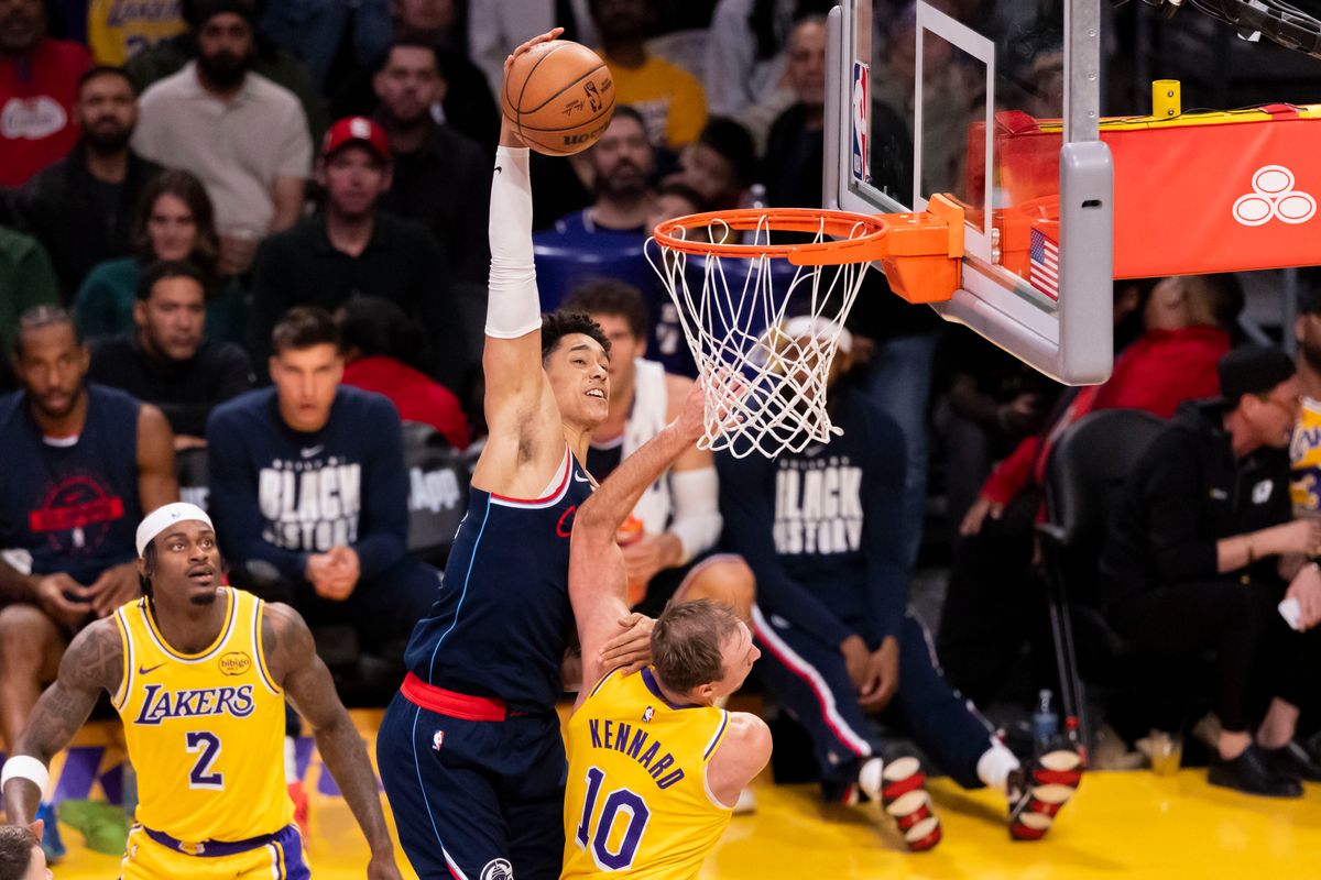 Yanic Konan Niederhauser #14 of the LA Clippers attempts a dunk over Luke Kennard #10 of the Los Angeles Lakers during an NBA basketball game, Friday February 20, 2026 in Los Angeles, Calif. Yanic Konan Niederhauser #14 of the LA Clippers attempts a dunk over Luke Kennard #10 of the Los Angeles Lakers during an NBA basketball game, Friday February 20, 2026 in Los Angeles, Calif.