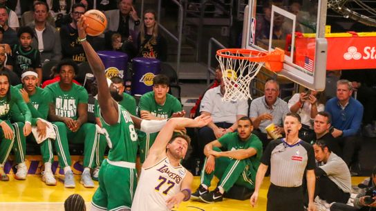Boston Celtics center Neemias Queta (88) dunks on Los Angeles Lakers guard Luka Doncic (77) during the first quarter at crypto.com Arena. Boston Celtics center Neemias Queta (88) dunks on Los Angeles Lakers guard Luka Doncic (77) during the first quarter at crypto.com Arena.