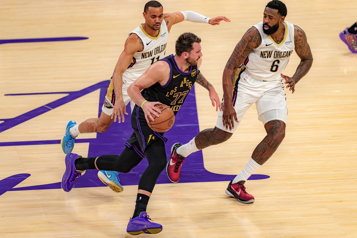 Los Angeles Lakers guard Luka Doncic (77) dribbling past defenders during an NBA basketball game against the New Orleans Pelicans on March 3rd, 2026 in Los Angeles, CA. Los Angeles Lakers guard Luka Doncic (77) dribbling past defenders during an NBA basketball game against the New Orleans Pelicans on March 3rd, 2026 in Los Angeles, CA.