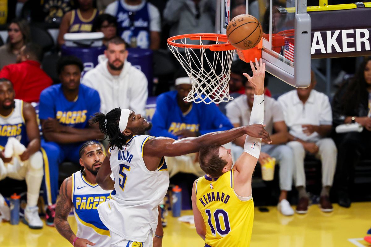 Luke Kennard #10 of the Los Angeles Lakers lays the ball up past Jarace Walker #5 of the Indiana Pacers during an NBA basketball game, Friday March 6, 2026 in Los Angeles, Calif.