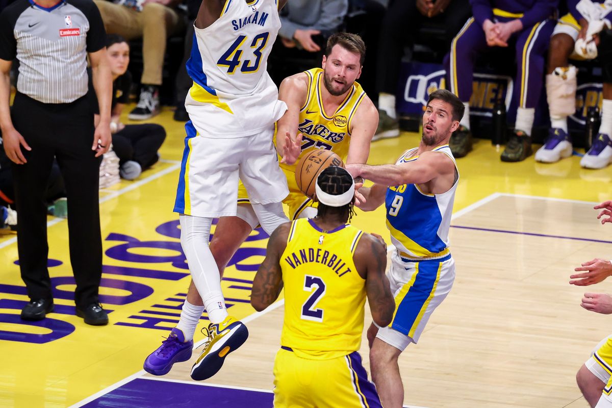 Luka Dončić #77 of the Los Angeles Lakers splits the defense to pass the ball during an NBA basketball game against the Indiana Pacers, Friday March 6, 2026 in Los Angeles, Calif.