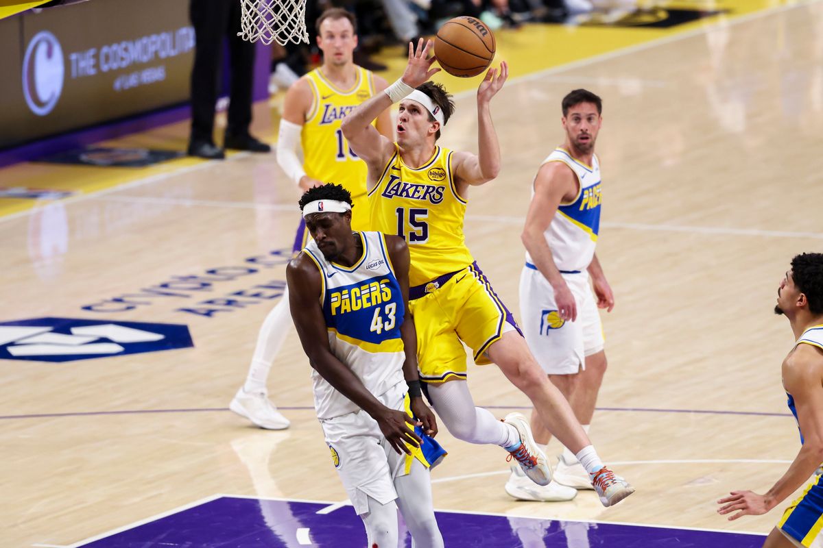 Austin Reaves #15 of the Los Angeles Lakers collides with Pascal Siakam #43 of the Indiana Pacers as he drives towards the basket during an NBA basketball game, Friday March 6, 2026 in Los Angeles, Calif.