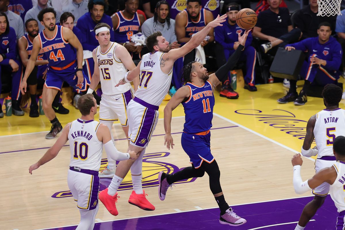 Los Angeles Lakers guard Luka Doncic (77) defends against New York Knicks guard Jalen Brunson (11) during an NBA game on March 8, 2026 in Los Angeles, CA.