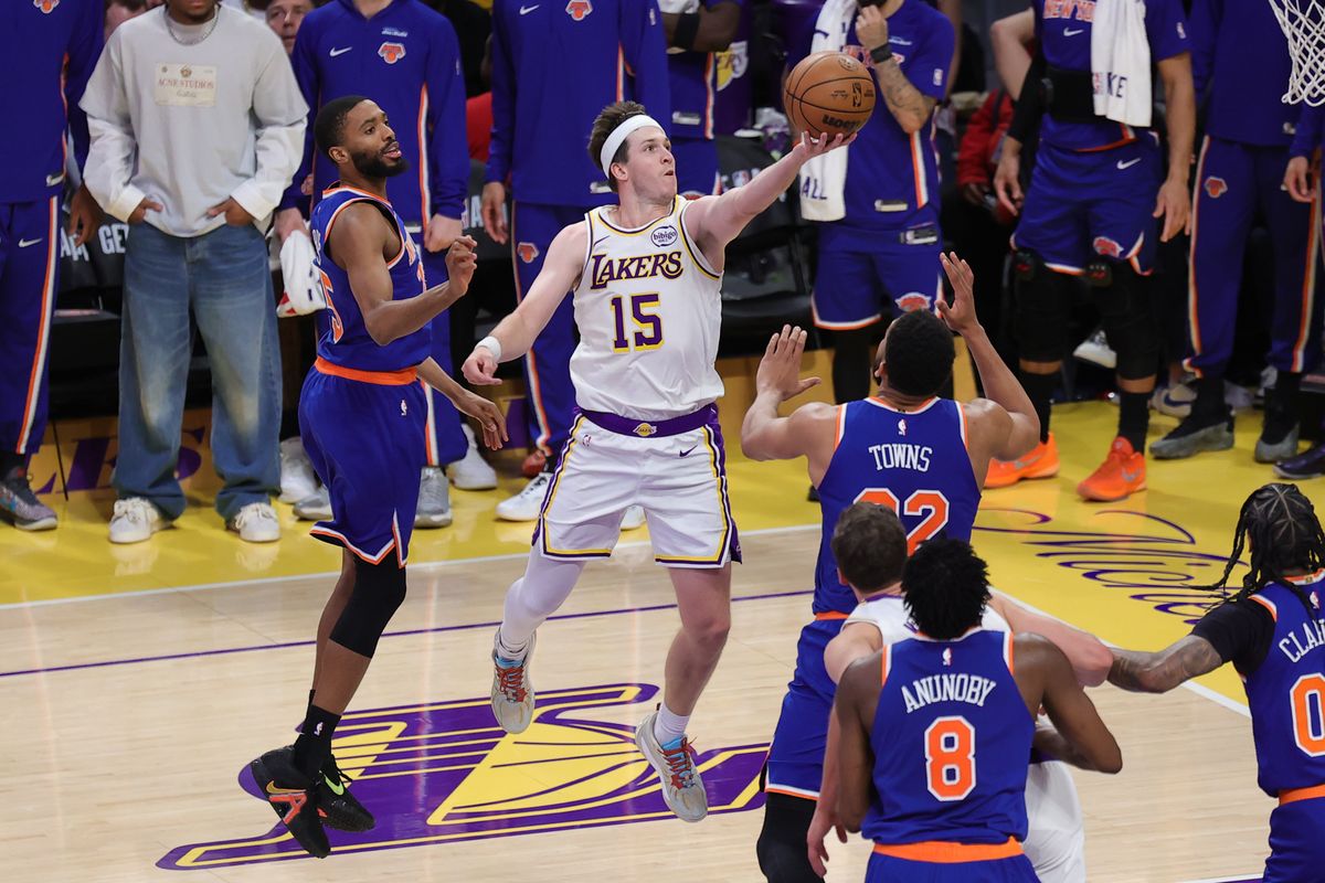 Los Angeles Lakers guard Austin Reaves (15) drives in for a lay up during an NBA game against the New York Knicks on March 8, 2026 in Los Angeles, CA.