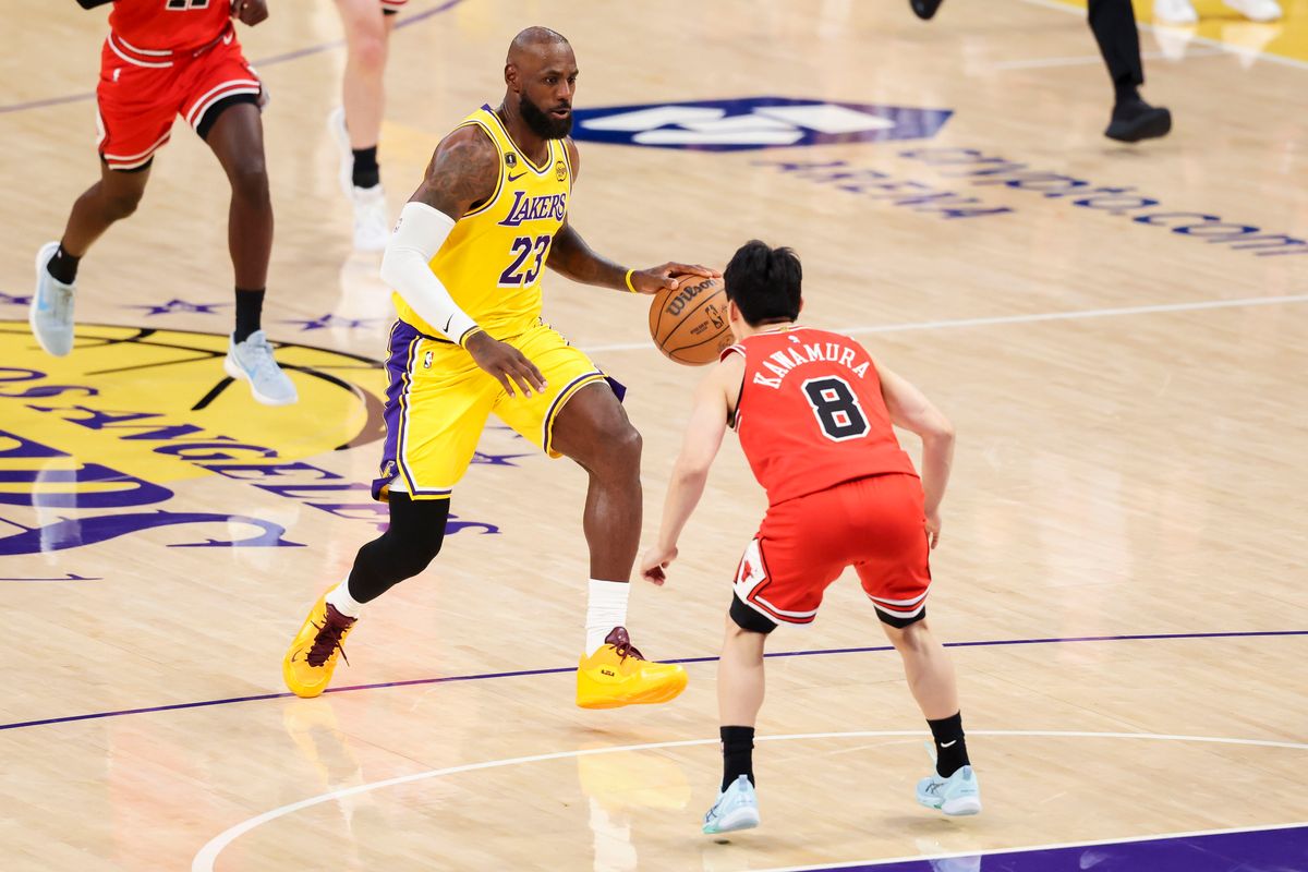 LeBron James #23 of the Los Angeles Lakers drives towards the rim as Yuki Kawamura #8 of the Chicago Bulls steps in front to defend during an NBA basketball game, Thursday March 12, 2026 in Los Angeles, Calif.