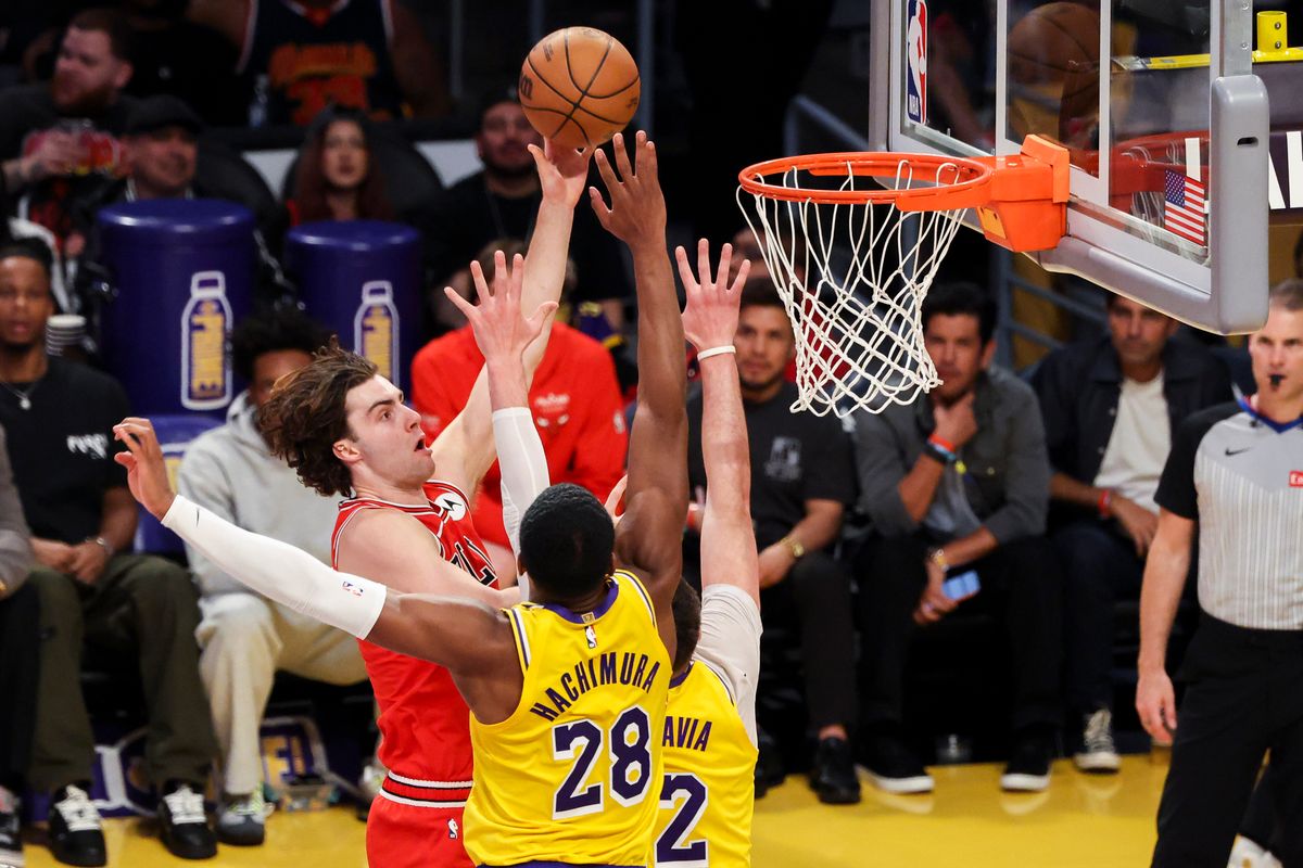 Josh Giddey #3 of the Chicago Bulls lays the bal up over Rui Hachimura #28 of the Los Angeles Lakers during an NBA basketball game, Thursday March 12, 2026 in Los Angeles, Calif.