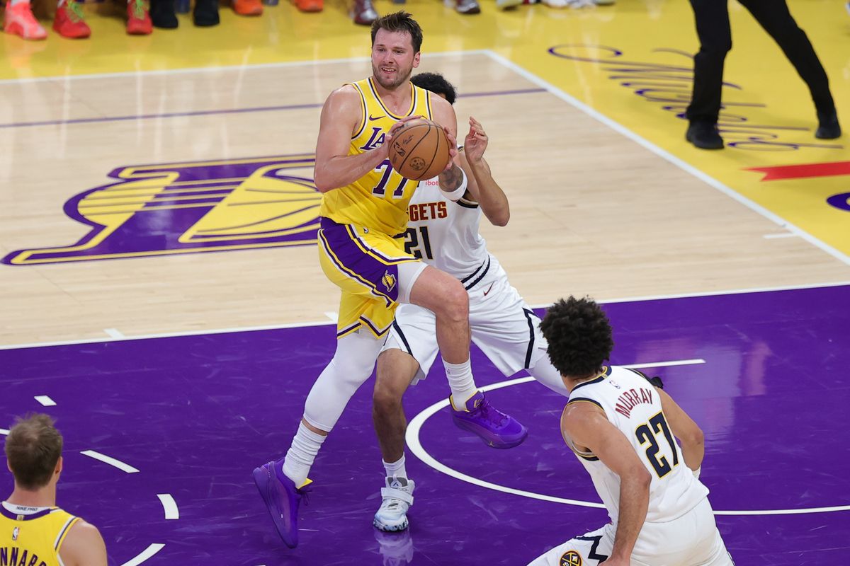Los Angeles Lakers guard Luka Doncic (77) looks to pass the basketball during an NBA game against the Denver Nuggets on March 14, 2026 in Los Angeles, CA. Los Angeles Lakers guard Luka Doncic (77) looks to pass the basketball during an NBA game against the Denver Nuggets on March 14, 2026 in Los Angeles, CA.
