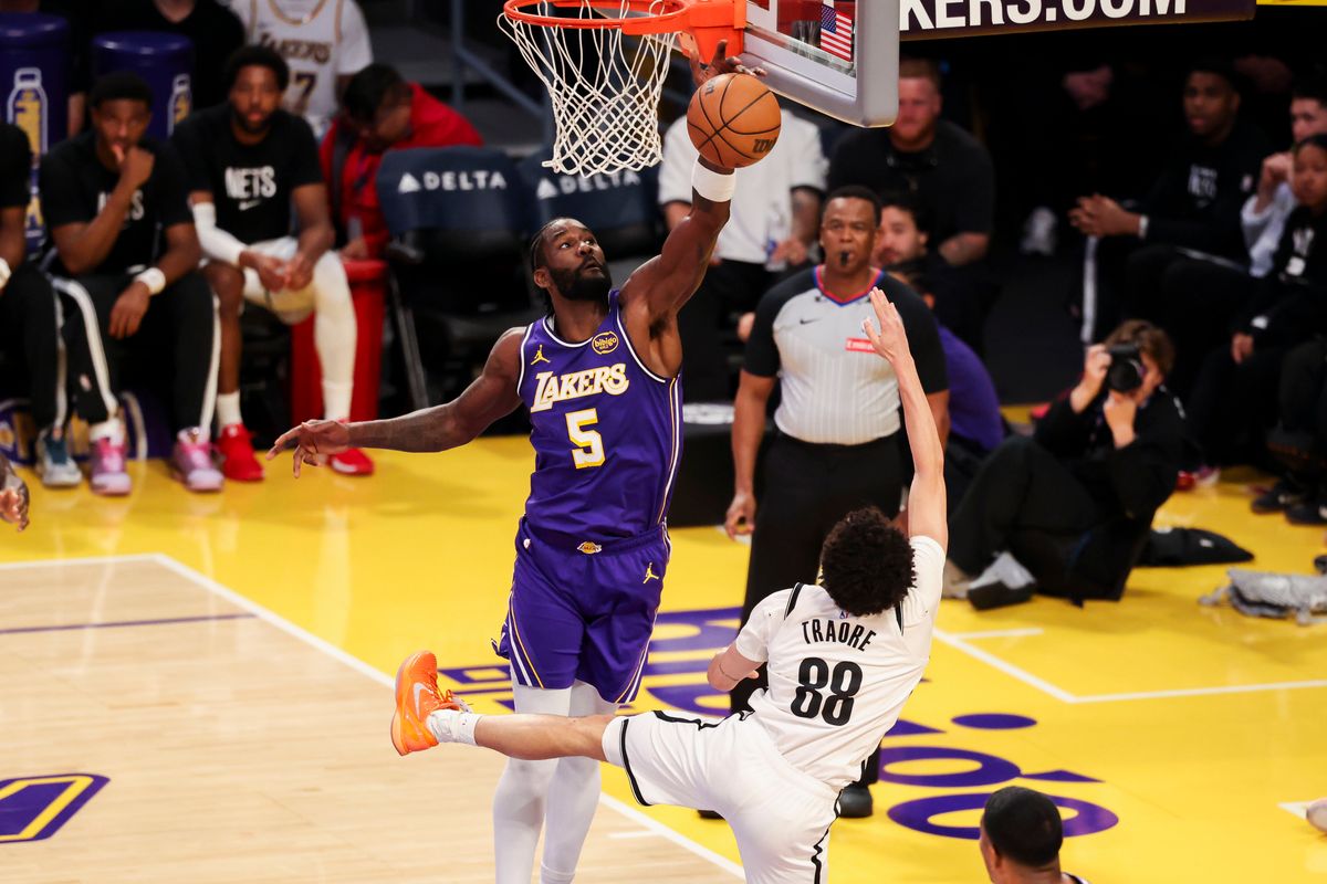 Deandre Ayton #5 of the Los Angeles Lakers blocks the shot by Nolan Traore #88 of the Brooklyn Nets during an NBA basketball game, Friday March 27, 2026 in Los Angeles, Calif.