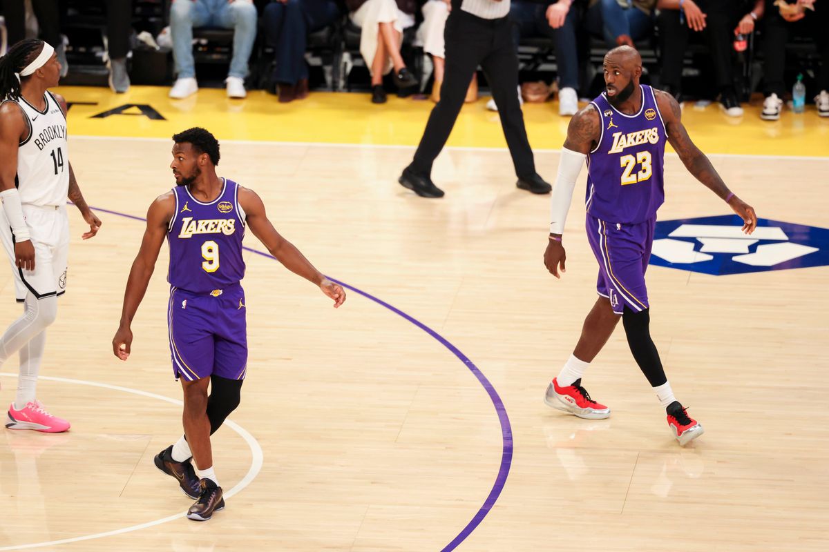 Bronny James #9 and LeBron James #23 of the Los Angeles Lakers on the court together during an NBA basketball game against the Brooklyn Nets, Friday March 27, 2026 in Los Angeles, Calif.