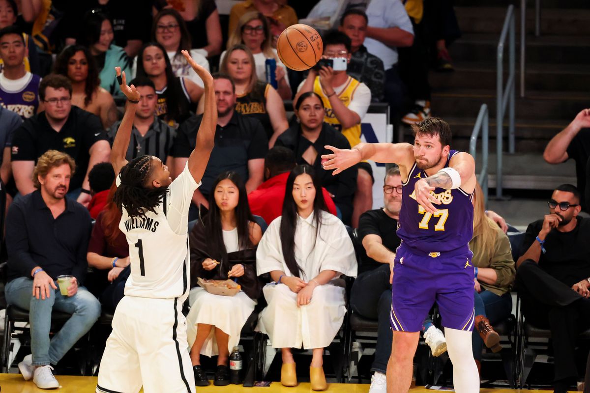 Luka Doncic #77 of the Los Angeles Lakers throws a cross-court pass during an NBA basketball game against the Brooklyn Nets, Friday March 27, 2026 in Los Angeles, Calif.