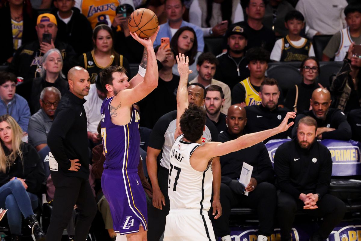Luka Doncic #77 of the Los Angeles Lakers shoots a three point shot during an NBA basketball game against the Brooklyn Nets, Friday March 27, 2026 in Los Angeles, Calif.