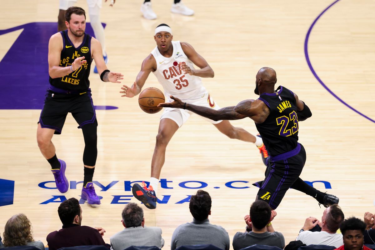 LeBron James #23 of the Los Angeles Lakers saves the ball from going out of bounds as Luka Doncic #77 of the Los Angeles Lakers and Nae’Qwan Tomlin #35 of the Cleveland Cavaliers look on during an NBA basketball game, Tuesday March 31, 2026 in Los Angeles, Calif. LeBron James #23 of the Los Angeles Lakers saves the ball from going out of bounds as Luka Doncic #77 of the Los Angeles Lakers and Nae’Qwan Tomlin #35 of the Cleveland Cavaliers look on during an NBA basketball game, Tuesday March 31, 2026 in Los Angeles, Calif.