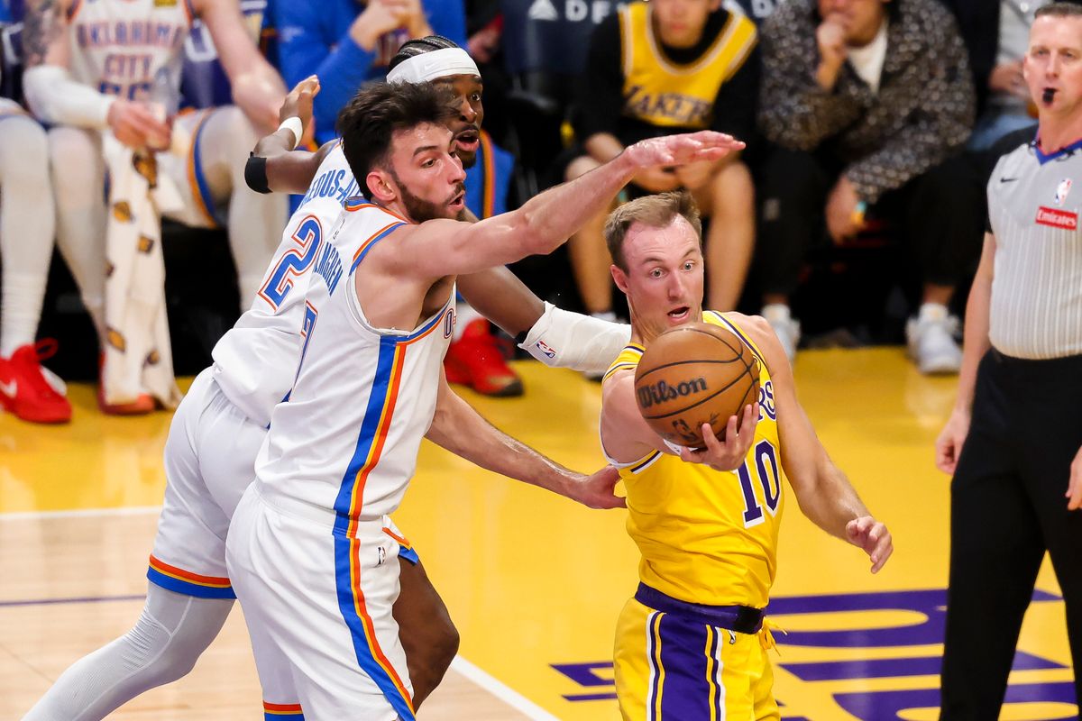 Luke Kennard #10 of the Los Angeles Lakers handles the ball against Chet Holmgren #7 and Shai Gilgeous-Alexander #2 of the Oklahoma City Thunder during an NBA basketball game, Tuesday April 7, 2026 in Los Angeles, Calif. Luke Kennard #10 of the Los Angeles Lakers handles the ball against Chet Holmgren #7 and Shai Gilgeous-Alexander #2 of the Oklahoma City Thunder during an NBA basketball game, Tuesday April 7, 2026 in Los Angeles, Calif.
