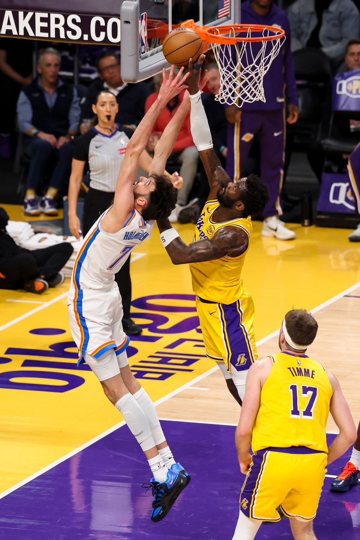 Chet Holmgren #7 of the Oklahoma City Thunder and Deandre Ayton #5 of the Los Angeles Lakers reach for the ball during an NBA basketball game, Tuesday April 7, 2026 in Los Angeles, Calif. Chet Holmgren #7 of the Oklahoma City Thunder and Deandre Ayton #5 of the Los Angeles Lakers reach for the ball during an NBA basketball game, Tuesday April 7, 2026 in Los Angeles, Calif.