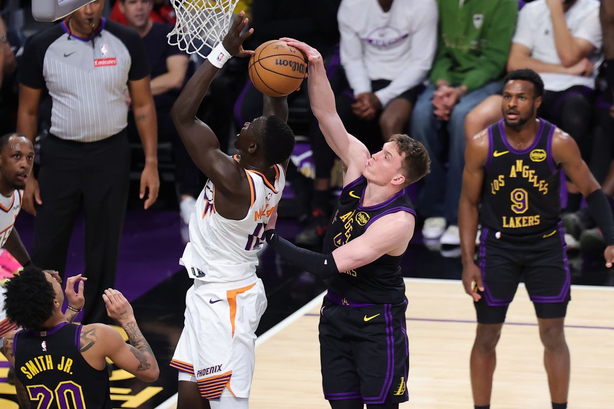 Los Angeles Lakers guard Dalton Knecht (4) blocks a shot during an NBA game against the Phoenix Suns on April 10, 2026 in Los Angeles, CA.