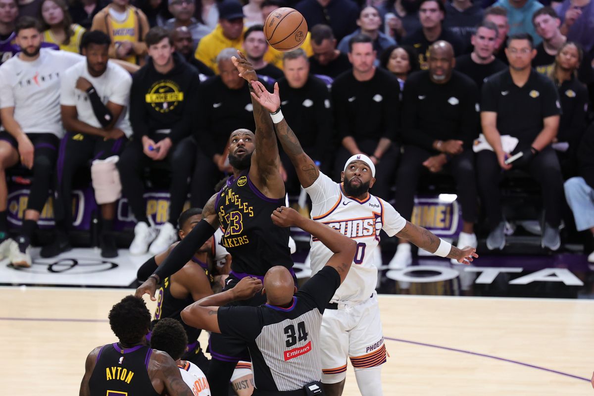 Los Angeles Lakers forward LeBron James (23) and Phoenix Suns forward Royce O'neale (0) battle for the jump ball during an NBA game on April 10, 2026 in Los Angeles, CA.