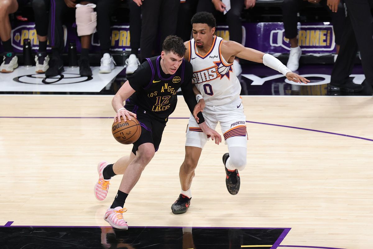 Los Angeles Lakers forward Jake LaRavia (12) dribbles the basketball during an NBA game against the Phoenix Suns on April 10, 2026 in Los Angeles, CA.