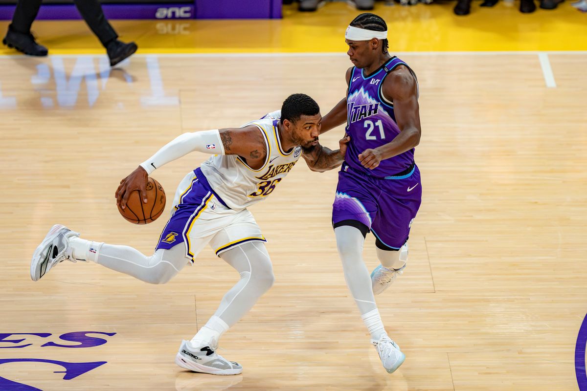 Los Angeles Lakers guard Marcus Smart (36) dribbling around Bez Mbeng (21) during an NBA basketball game against the Utah Jazz on April 12th, 2026 in Los Angeles, CA.